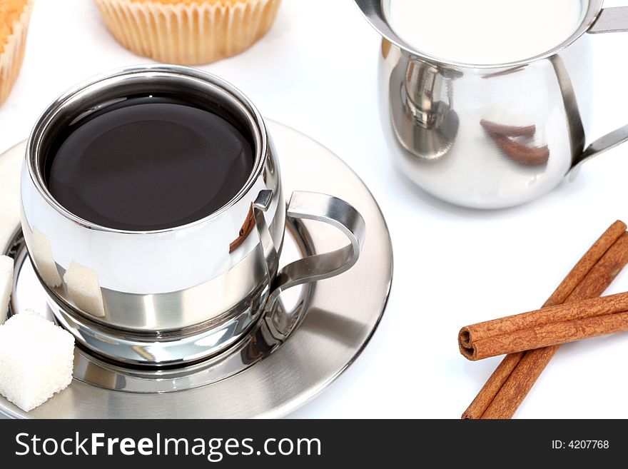 Cup Of Black Coffee With Muffin, Milk And Cinnamon