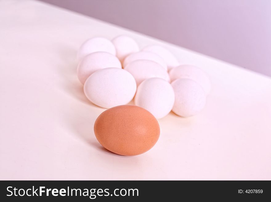 White and brown eggs on the table