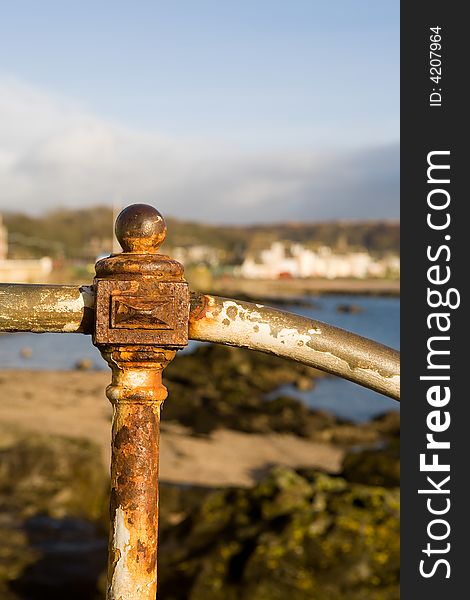 Rusty handrail in a coast village