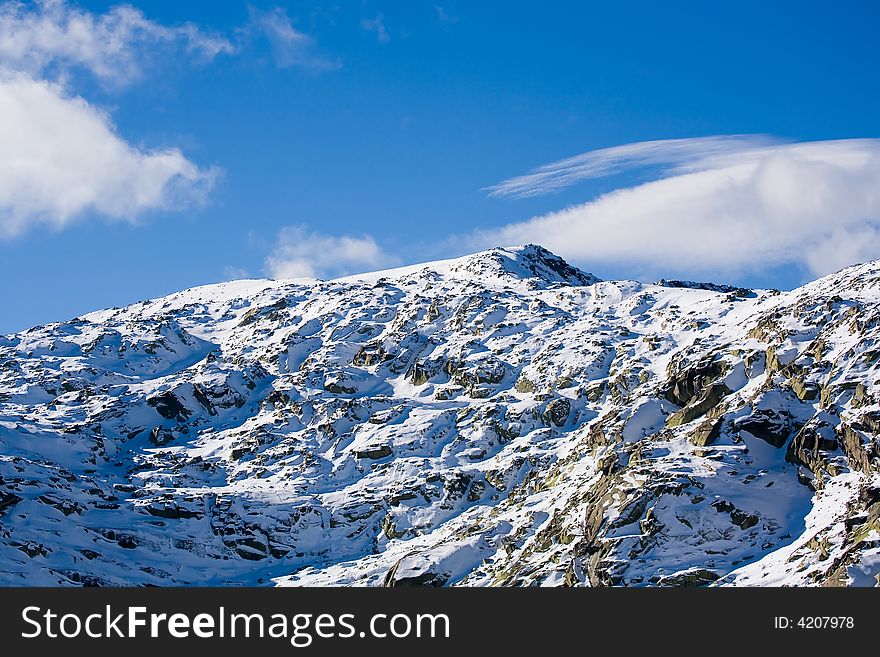 Mountain peak covered with snow. Gredos regional park, Spain. Mountain peak covered with snow. Gredos regional park, Spain