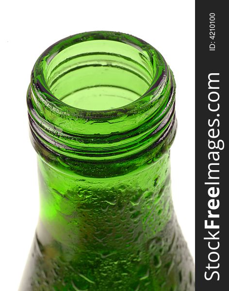 Bottled water in green, condensation-covered bottle; differential focus