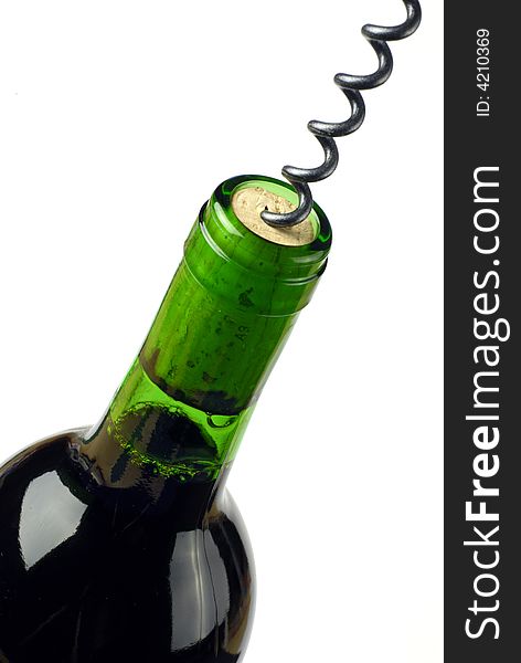 Detail of green wine bottle being opened; isolated on white ground