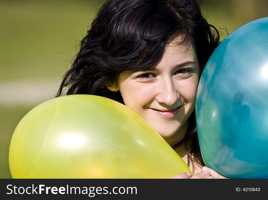 Cute girl between two colored balloons. Cute girl between two colored balloons