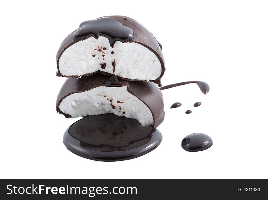 Marshmallows in chocolate syrup isolated