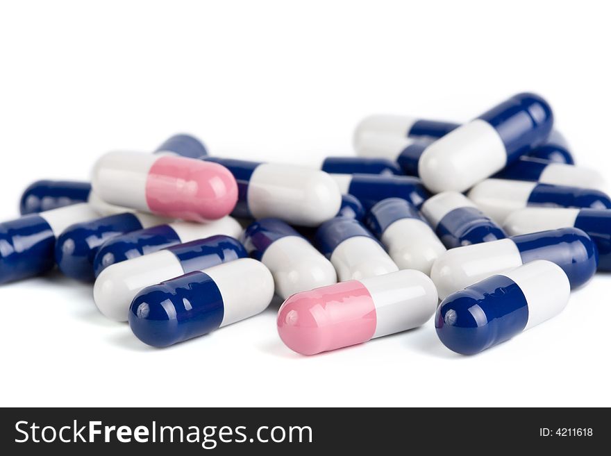 Blue and pink capsule pills isolated