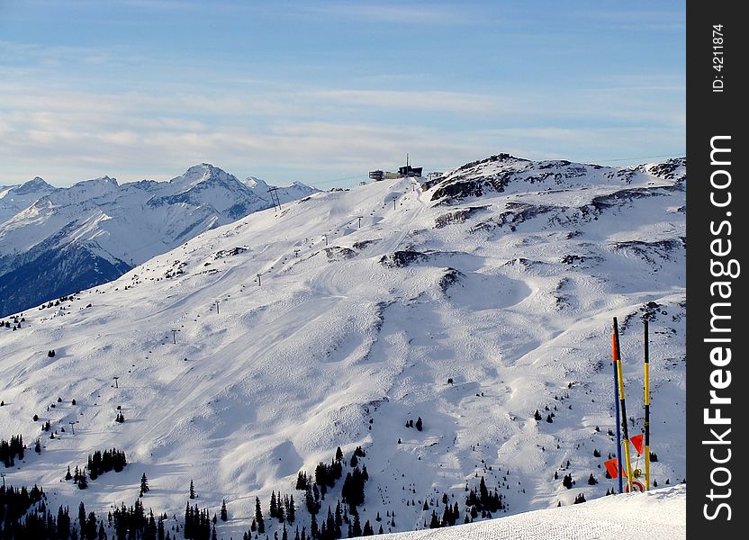 Ski Area of Flims Laax in Eastern Switzerland. Mountain, cable car station and restaurant are named Crap Sogn Gion, 2228 m / 7310 ft.