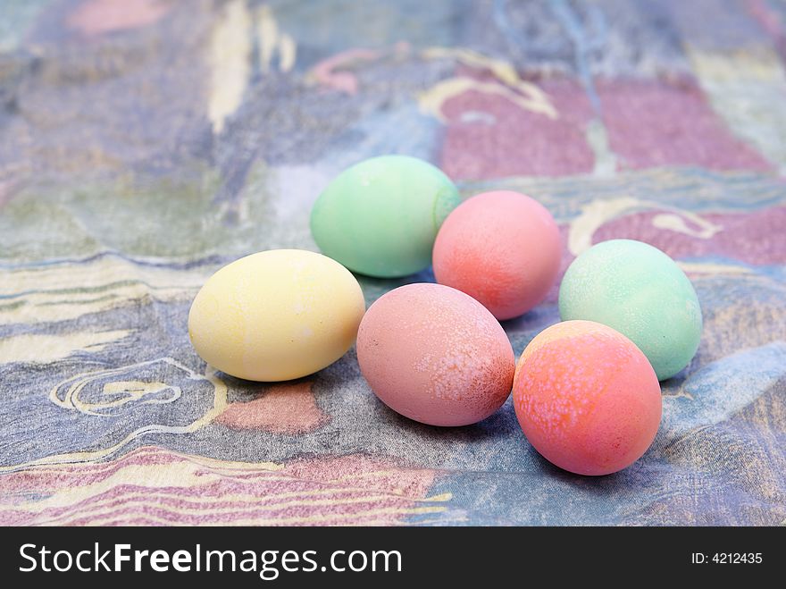 Colorful pastel Easter eggs on spring toned complimentary background. Colorful pastel Easter eggs on spring toned complimentary background