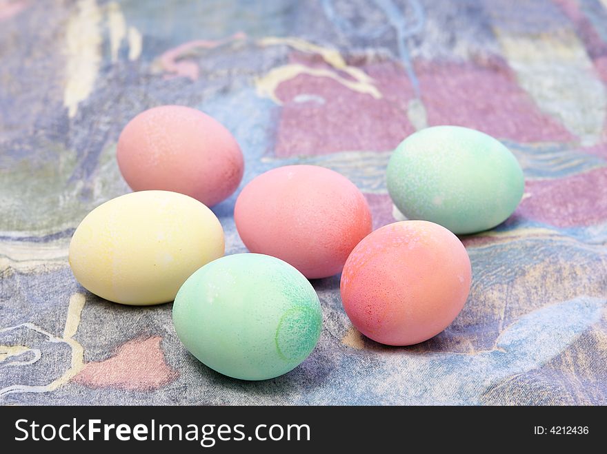 Colorful pastel Easter eggs on spring toned complimentary background. Colorful pastel Easter eggs on spring toned complimentary background