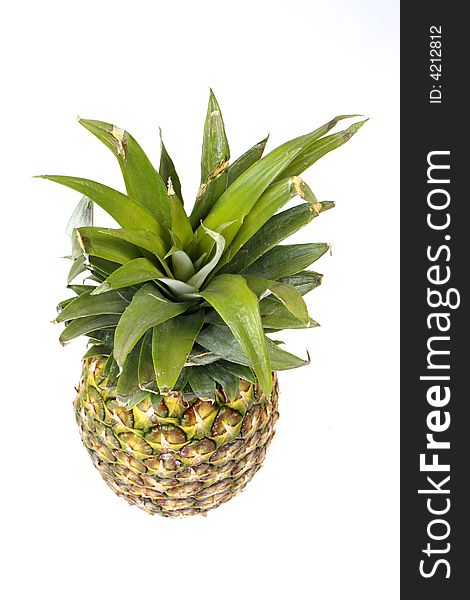 Pineapple shot from above, isolated on white. Pineapple shot from above, isolated on white