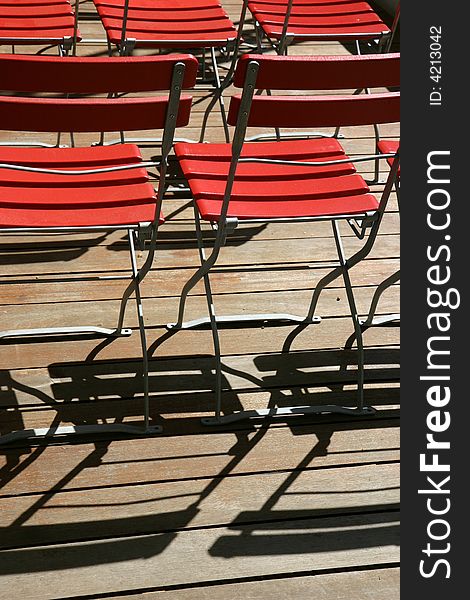 Red wooden chairs on a terrasse. Red wooden chairs on a terrasse