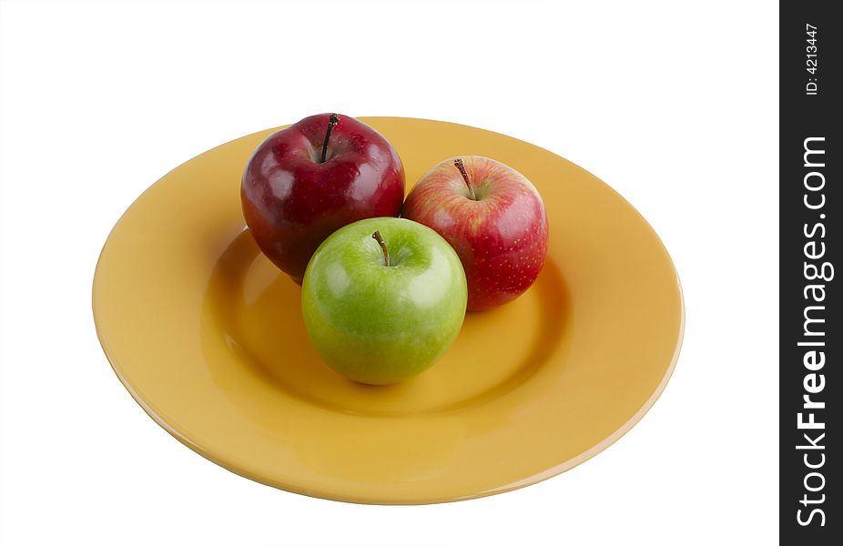Red and Green Apples on Bright Yellow Plate Isolated on White Background. Red and Green Apples on Bright Yellow Plate Isolated on White Background