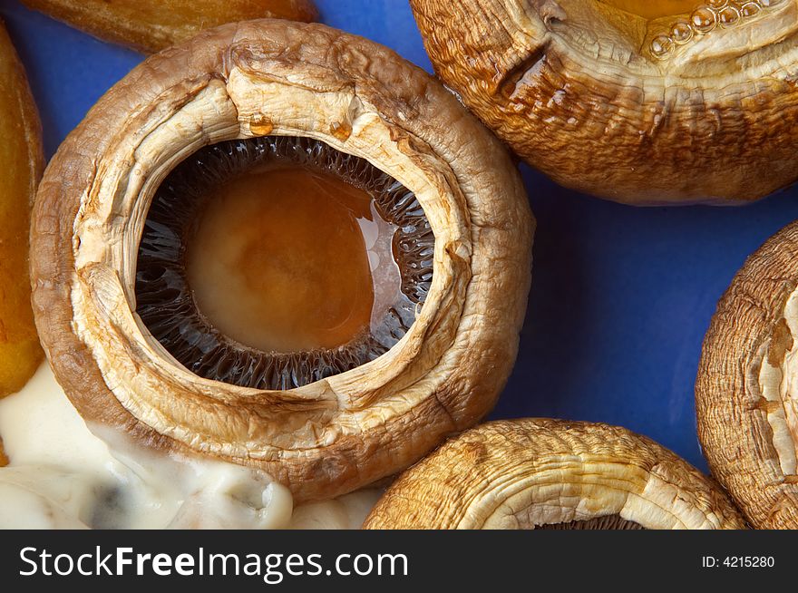 Macro closeup of juicy grilled field mushrooms. Macro closeup of juicy grilled field mushrooms