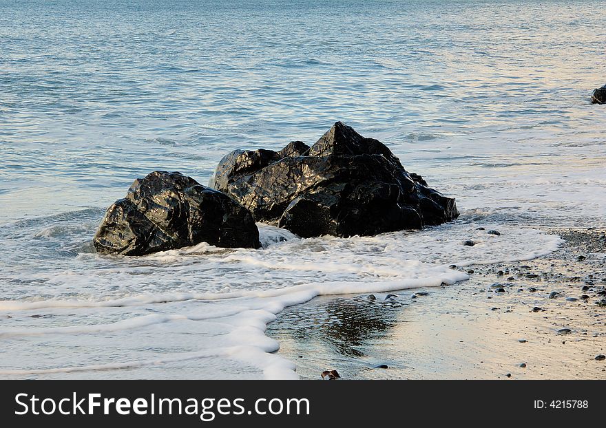 Rocks In The Ocean Surf