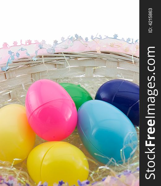 Easter eggs in basket, isolated on white