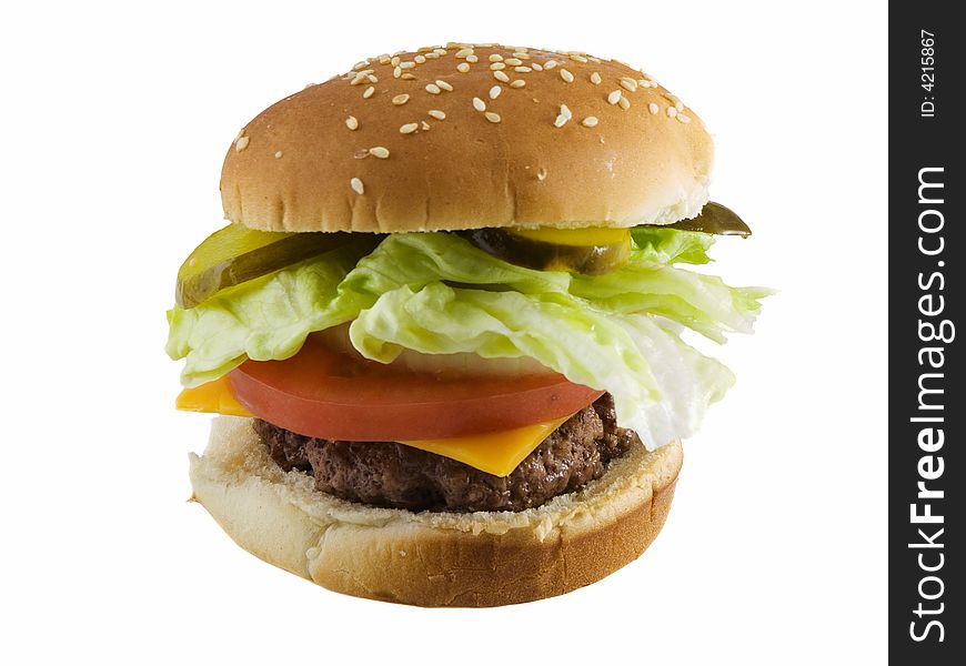 Cheeseburger with pickles, lettuce, onions, tomato, and cheese. Isolated on white