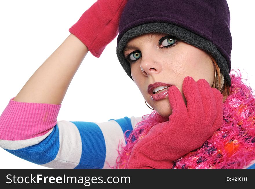 Portrait of beautiful girl in winter clothes isilated on a white background
