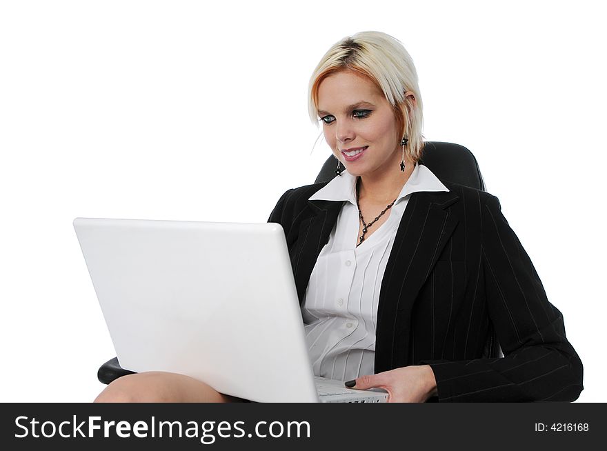 Businesswoman on her laptop smiling