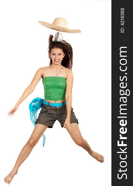 Young girl jumps with hat hanging in the air