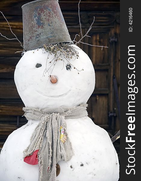Winter. A figure made from snows with a bucket on a head. Winter. A figure made from snows with a bucket on a head.