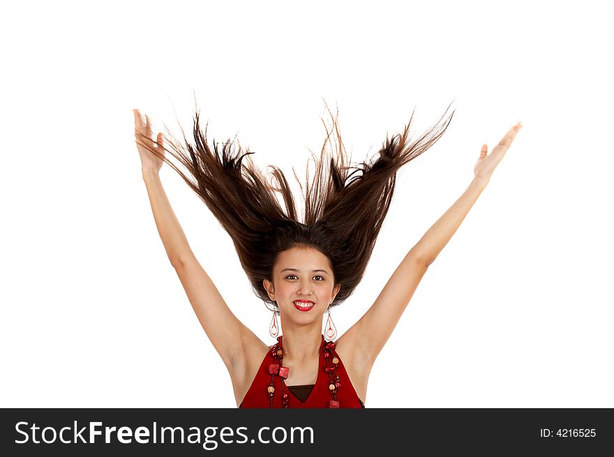 Fashionable young woman with hair flowing in the air