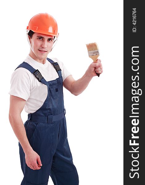 Muscular young man in a builder uniform with tools. Muscular young man in a builder uniform with tools.