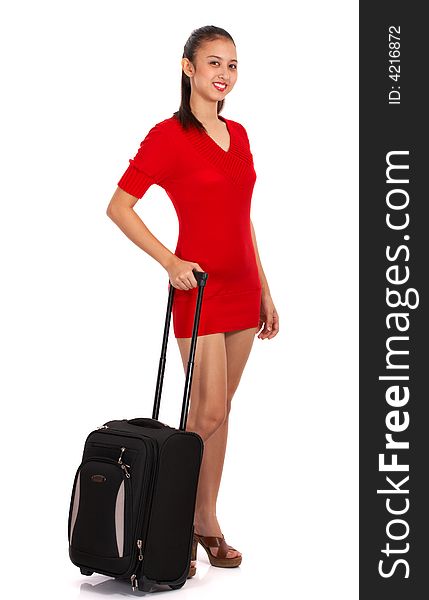 Girl in red dress holding traveling bag