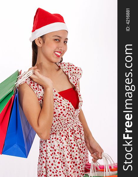 Girl in red dress holding shopping bags