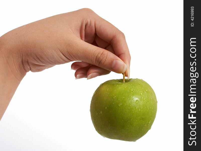 Holding a fresh and tasty green apple