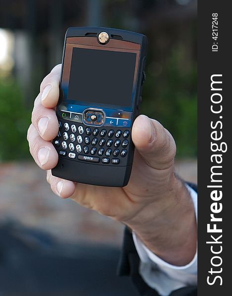 Modern mobile cell phone being held with blank screen