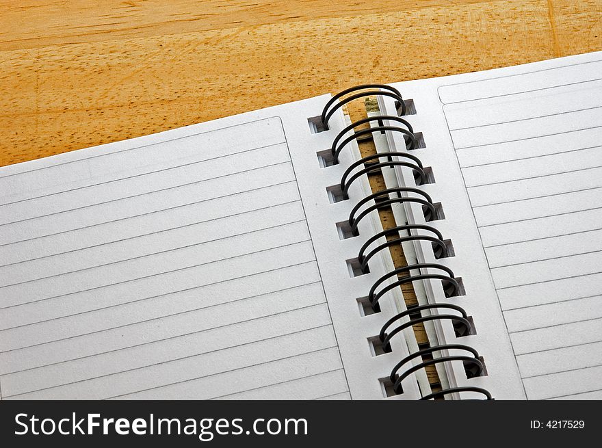 Spiral notepad on wooden background