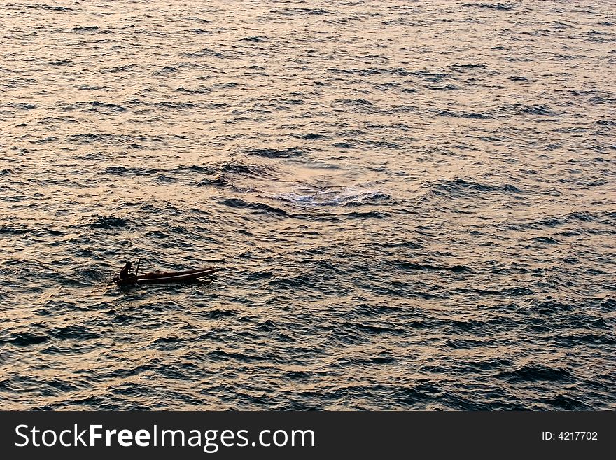 Ocean sunset and indian fisherman