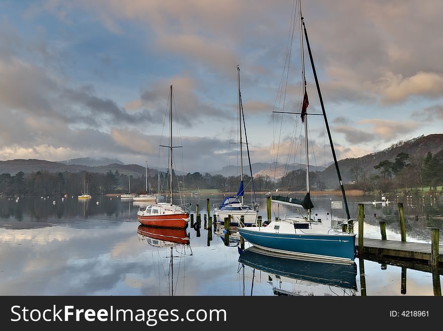 Boats at Waterhead, Ambleside  in early morning light. Boats at Waterhead, Ambleside  in early morning light
