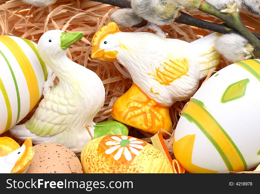 Easter decoration - goose, chick and eggs in a basket