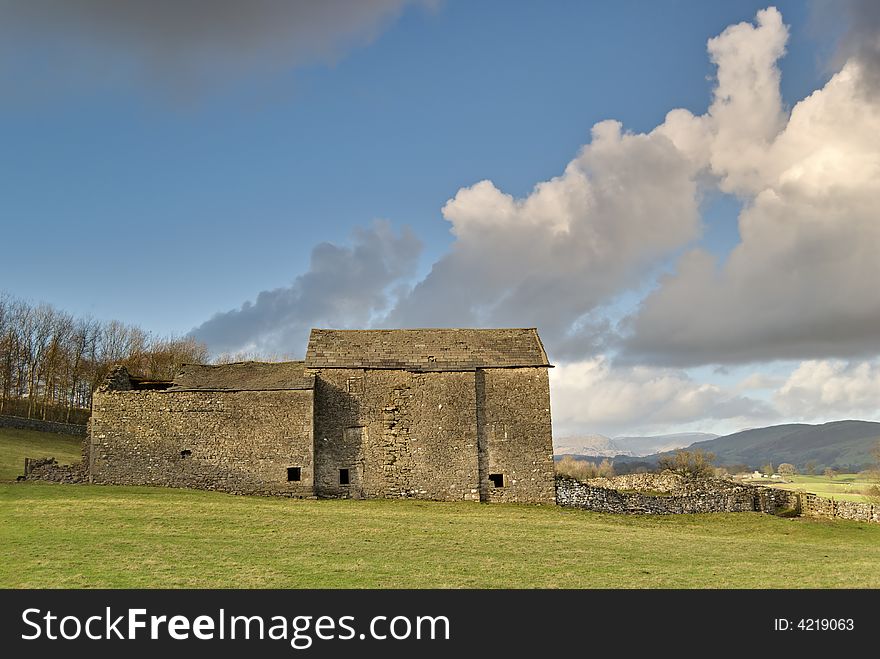 A ruined Lake District barn with Cumulus clouds. A ruined Lake District barn with Cumulus clouds