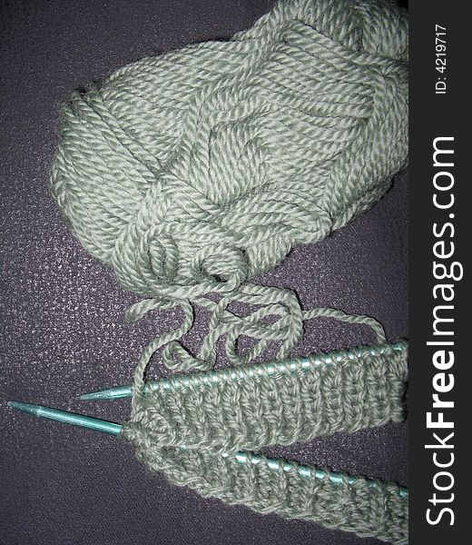 Work in progress with green wool. Work in progress with green wool