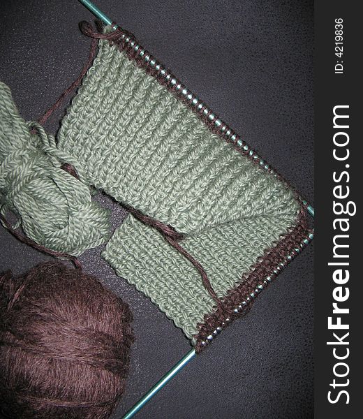 Work in progress with green and brown wool. Work in progress with green and brown wool