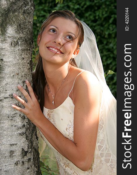 Young bride posing in the wedding day. Young bride posing in the wedding day