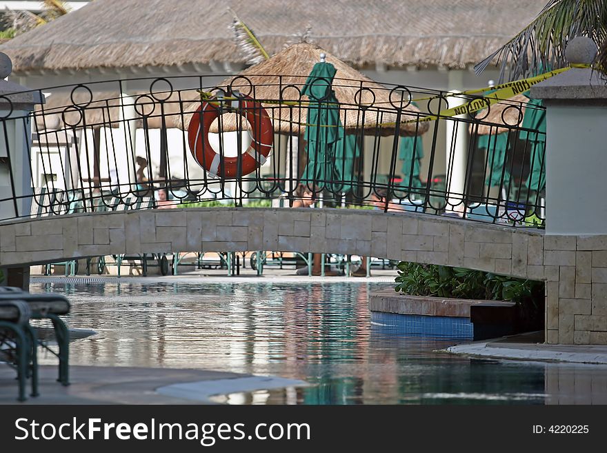 A lagoon type swimming pool under a bridge. A lagoon type swimming pool under a bridge