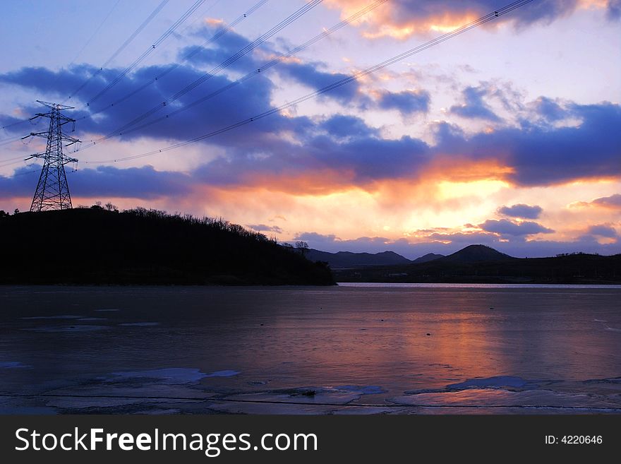 Sunset clouds and freezen water