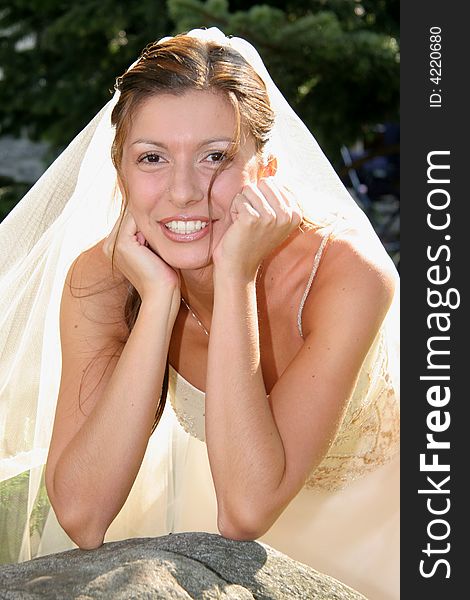 Young bride posing in the wedding day. Young bride posing in the wedding day