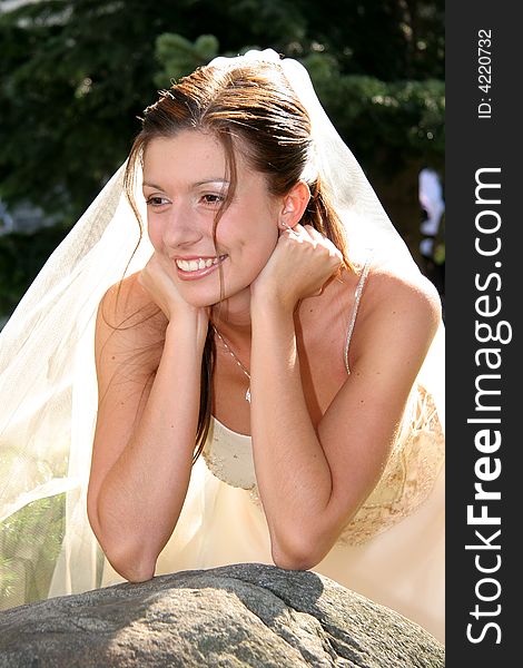 Young bride posing in the wedding day. Young bride posing in the wedding day