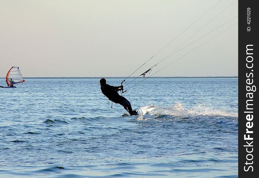 Silhouette of a kite-surf on waves of a gulf 1. Silhouette of a kite-surf on waves of a gulf 1