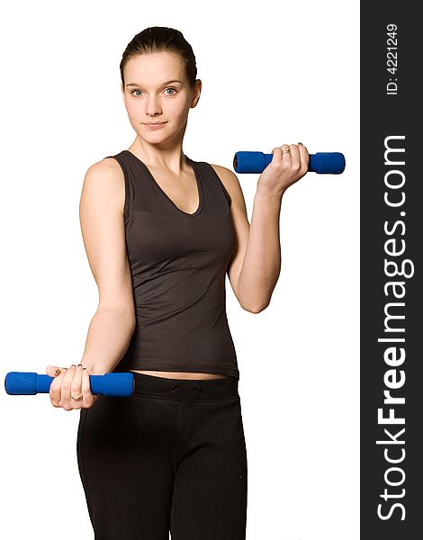 Young girl is sporting in the studio on a white background. Young girl is sporting in the studio on a white background