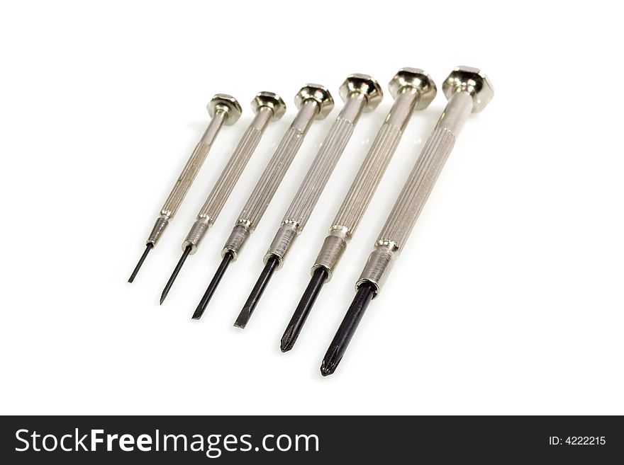 Metal Screw Driver in a row on bright Background. Metal Screw Driver in a row on bright Background