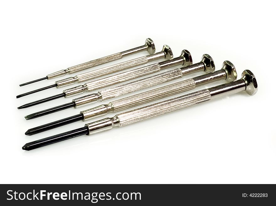 Metal Screw Driver in a row on bright Background