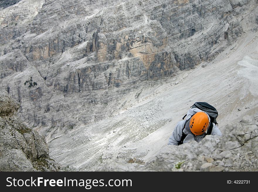 Rock climber on Via Ferrata in Italy