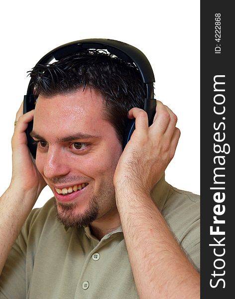 A man, wearing headphones, listening to some music, looking happy. A man, wearing headphones, listening to some music, looking happy