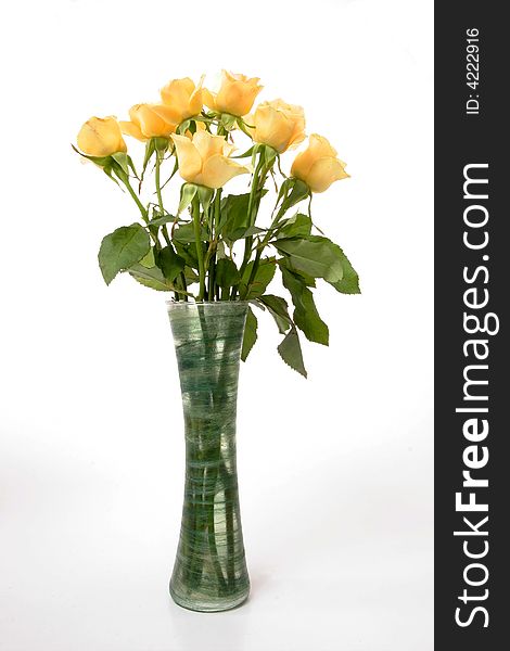 Bunch of cream roses in green vase