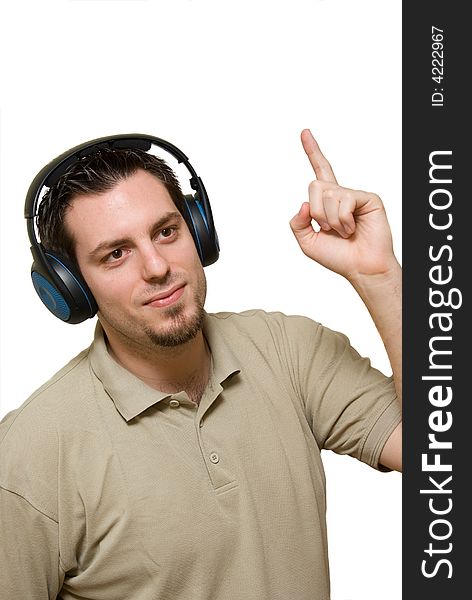 A man, wearing headphones, listening to some music, pointing his finger up. A man, wearing headphones, listening to some music, pointing his finger up