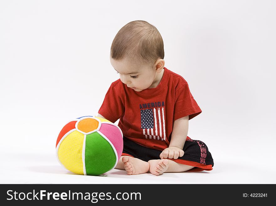 Curious baby in red t shirt. Curious baby in red t shirt